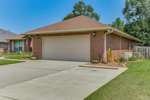 ranch-style house with a front yard and a garage