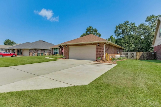 single story home featuring a garage and a front lawn