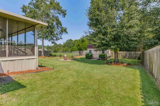 view of yard featuring a sunroom