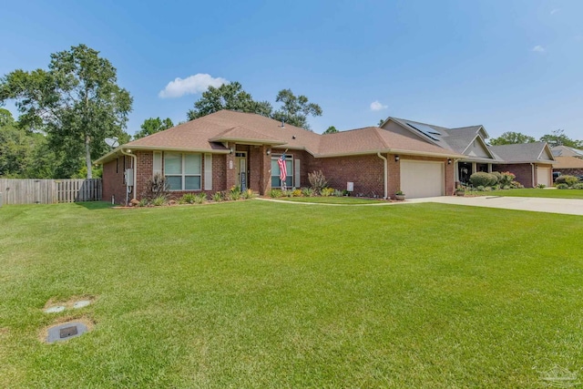 ranch-style home featuring a front yard and a garage