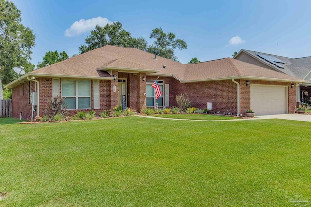 ranch-style home with a garage and a front lawn