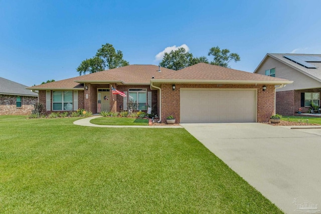 ranch-style house featuring a front yard and a garage