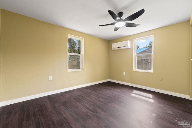 spare room with ceiling fan, a wall mounted AC, and hardwood / wood-style flooring