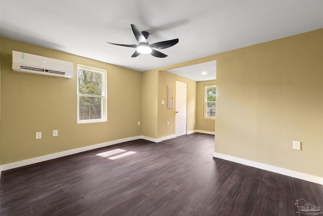 spare room with ceiling fan, dark hardwood / wood-style floors, and a wall mounted air conditioner