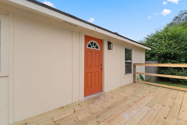 doorway to property with a wooden deck