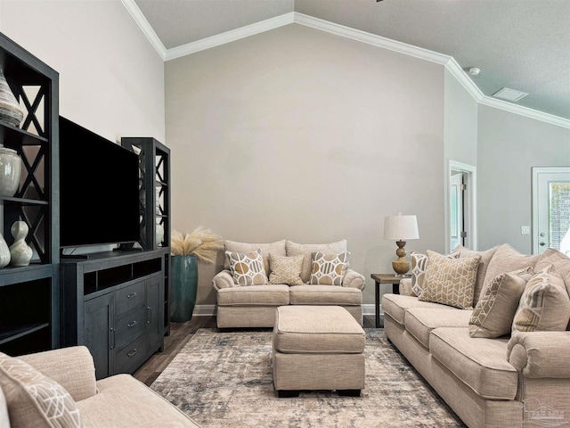 living room featuring a textured ceiling, lofted ceiling, hardwood / wood-style flooring, and ornamental molding