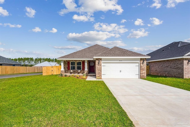 view of front of home featuring a front lawn and a garage