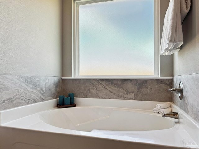 bathroom with a washtub