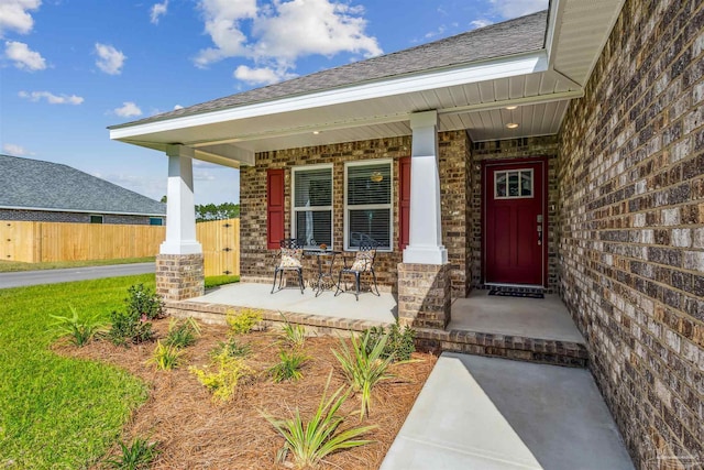 doorway to property featuring a porch