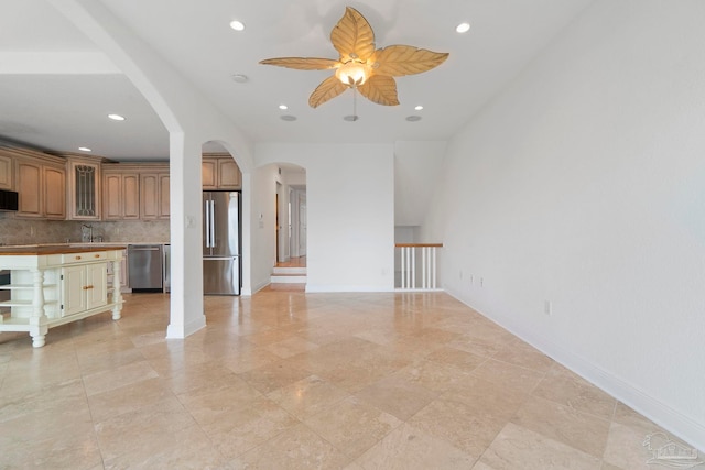 8520 Gulf Blvd Unit 23, Navarre Beach, FL 32566 - unfurnished living room with ceiling fan, arched walkways, recessed lighting, and baseboards