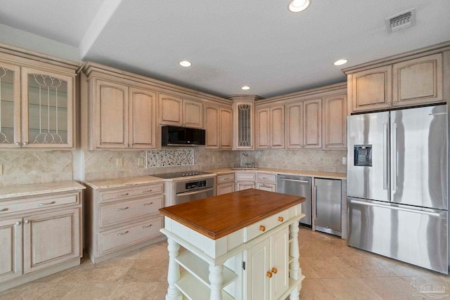 8520 Gulf Blvd Unit 23, Navarre Beach, FL 32566 - kitchen featuring black appliances, open shelves, a sink, tasteful backsplash, and glass insert cabinets