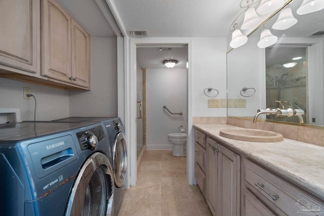 8520 Gulf Blvd Unit 23, Navarre Beach, FL 32566 - bathroom featuring independent washer and dryer, vanity, a shower, toilet, and tile patterned floors
