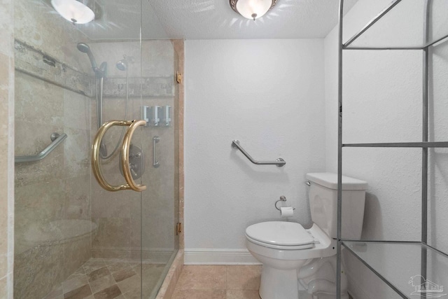 8520 Gulf Blvd Unit 23, Navarre Beach, FL 32566 - bathroom with toilet, a stall shower, baseboards, and tile patterned floors
