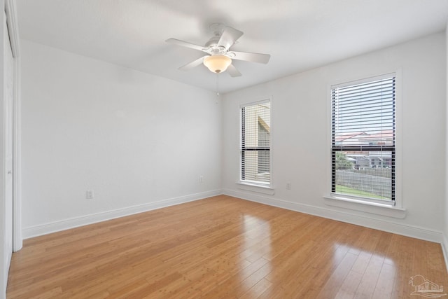 8520 Gulf Blvd Unit 23, Navarre Beach, FL 32566 - empty room featuring light wood finished floors, baseboards, and ceiling fan