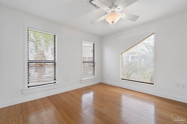 8520 Gulf Blvd Unit 23, Navarre Beach, FL 32566 - empty room featuring baseboards, wood finished floors, and a ceiling fan