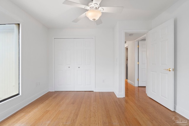 8520 Gulf Blvd Unit 23, Navarre Beach, FL 32566 - unfurnished bedroom with light wood-style floors, baseboards, and ceiling fan