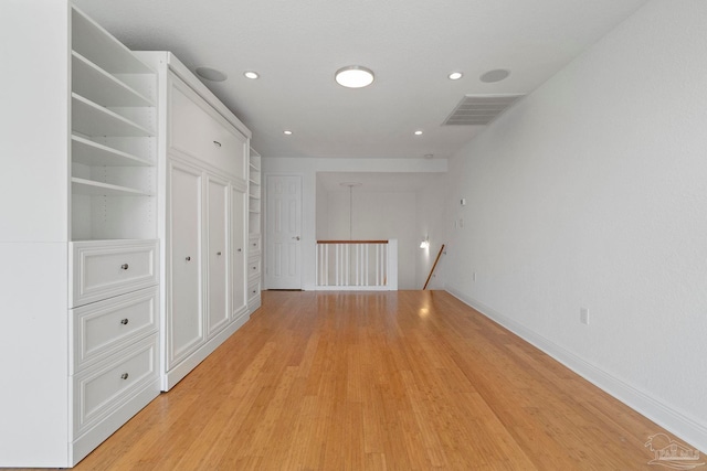 8520 Gulf Blvd Unit 23, Navarre Beach, FL 32566 - corridor with an upstairs landing, light wood finished floors, baseboards, and recessed lighting