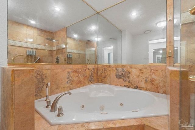 8520 Gulf Blvd Unit 23, Navarre Beach, FL 32566 - bathroom with a stall shower, a jetted tub, and recessed lighting