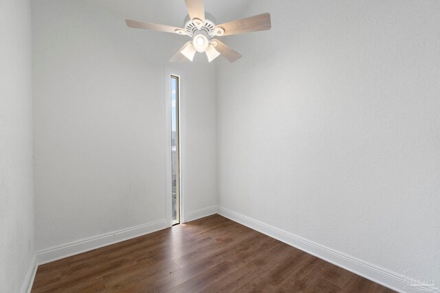 8520 Gulf Blvd Unit 23, Navarre Beach, FL 32566 - unfurnished room with dark wood finished floors, a ceiling fan, and baseboards