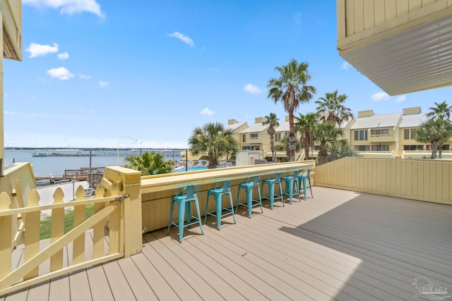 8520 Gulf Blvd Unit 23, Navarre Beach, FL 32566 - wooden deck with a water view and a residential view