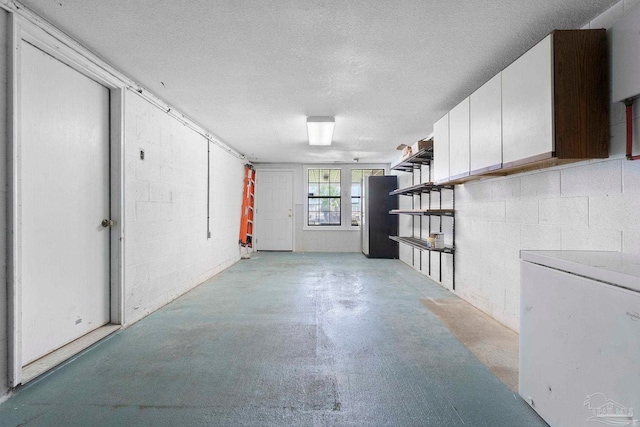 8520 Gulf Blvd Unit 23, Navarre Beach, FL 32566 - basement with a textured ceiling and concrete block wall
