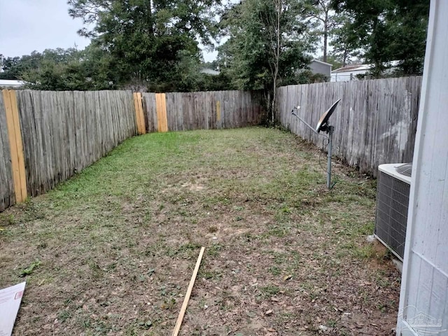 view of yard featuring central AC unit