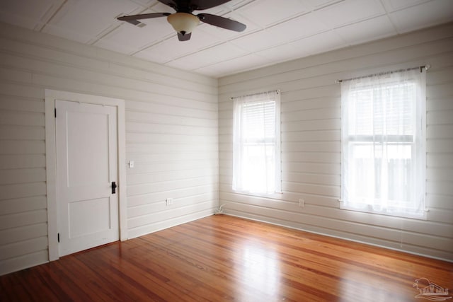 empty room with wood-type flooring and ceiling fan