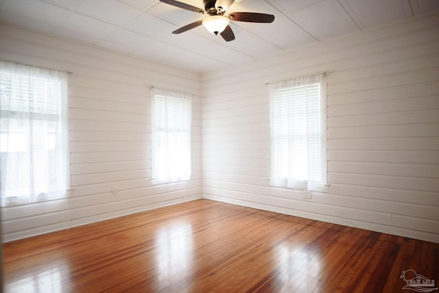 unfurnished room featuring hardwood / wood-style flooring and ceiling fan