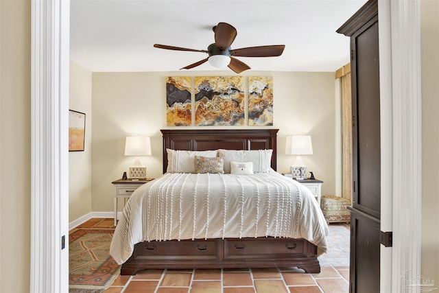 bedroom with ceiling fan and light tile patterned flooring