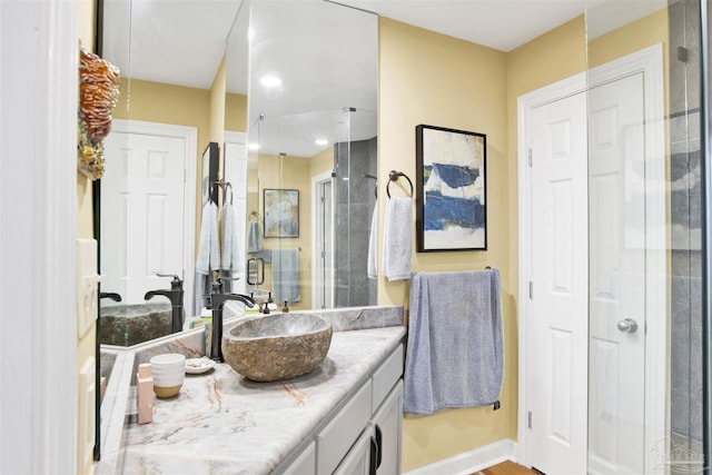 bathroom with vanity and walk in shower