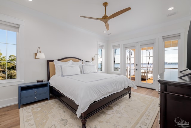 bedroom with light wood-type flooring, access to outside, ceiling fan, and ornamental molding