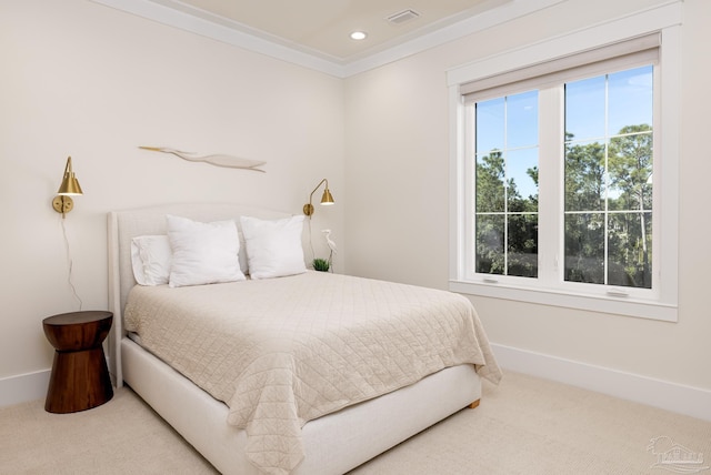 bedroom with carpet flooring and crown molding