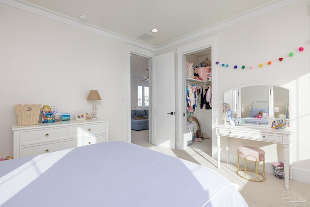 bedroom featuring ornamental molding and a closet