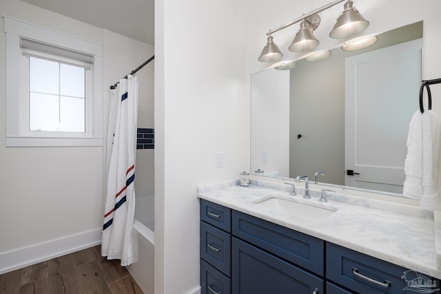 bathroom featuring vanity, shower / tub combo, and hardwood / wood-style flooring