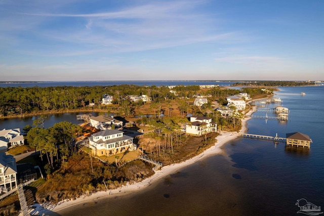 drone / aerial view featuring a view of the beach and a water view