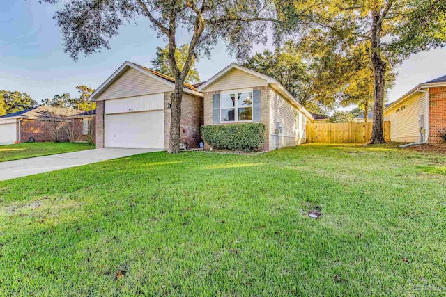 view of front of house with a front yard and a garage