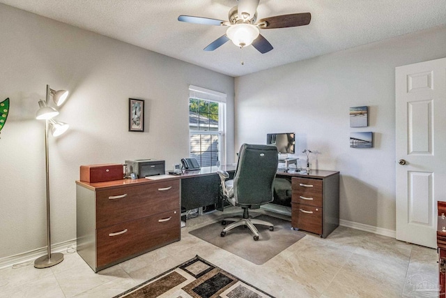 office space featuring ceiling fan and a textured ceiling