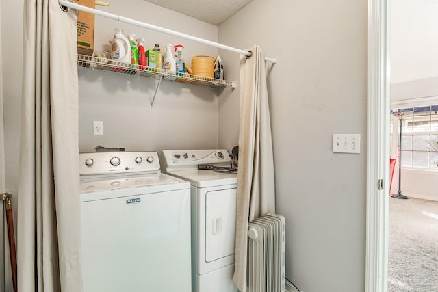 laundry area with carpet flooring, separate washer and dryer, a textured ceiling, and radiator