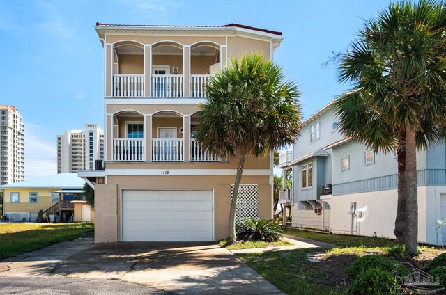 view of front of home with a balcony and a garage