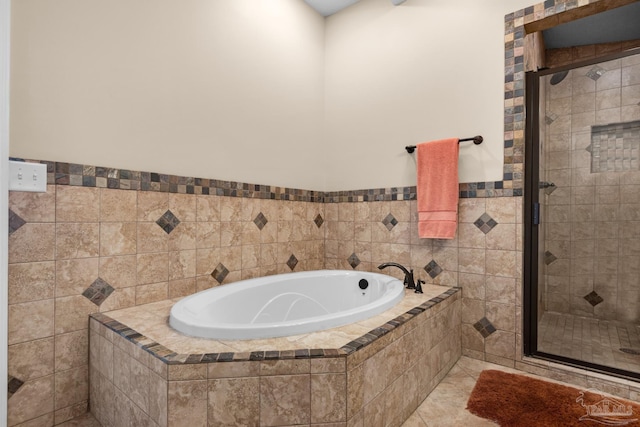 bathroom featuring plus walk in shower and tile patterned flooring