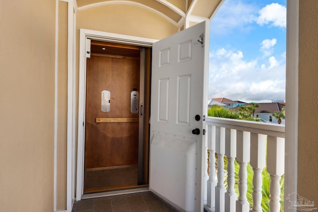 property entrance with a balcony