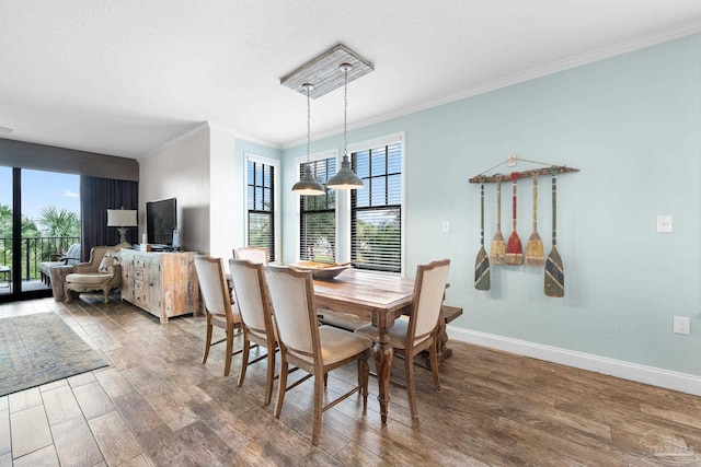 dining room with crown molding and a textured ceiling