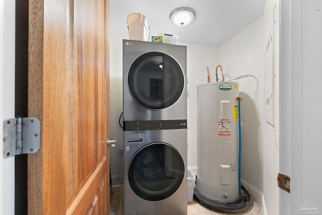 clothes washing area with water heater and stacked washer / dryer