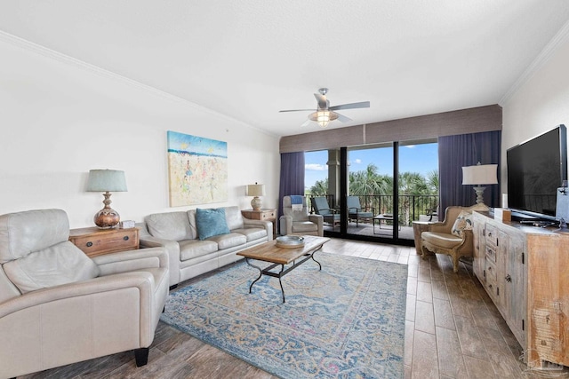 living room featuring hardwood / wood-style flooring, crown molding, and ceiling fan