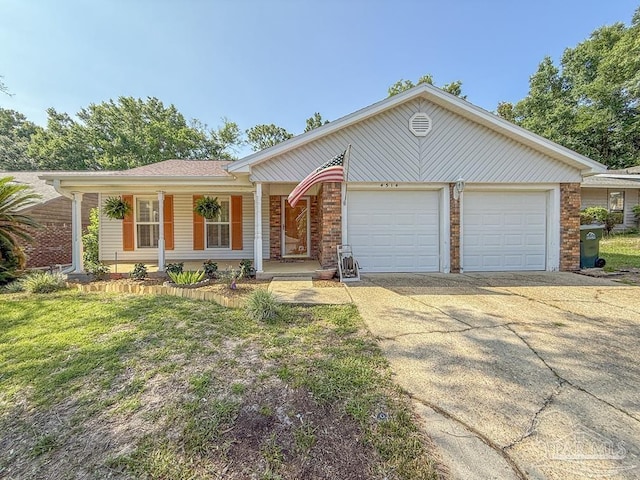 4514 Southpointe Ln, Pensacola, FL 32514 - ranch-style house featuring a garage, a porch, driveway, and brick siding