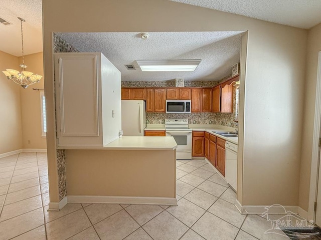 4514 Southpointe Ln, Pensacola, FL 32514 - kitchen with white appliances, a textured ceiling, light tile patterned floors, a sink, and light countertops