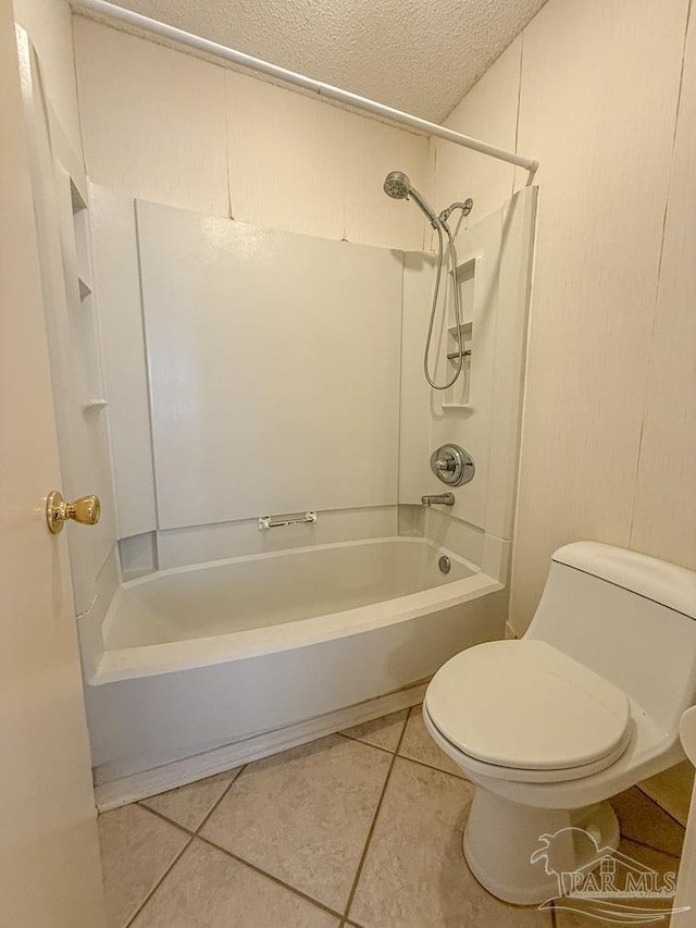 4514 Southpointe Ln, Pensacola, FL 32514 - bathroom featuring shower / washtub combination, a textured ceiling, toilet, and tile patterned flooring