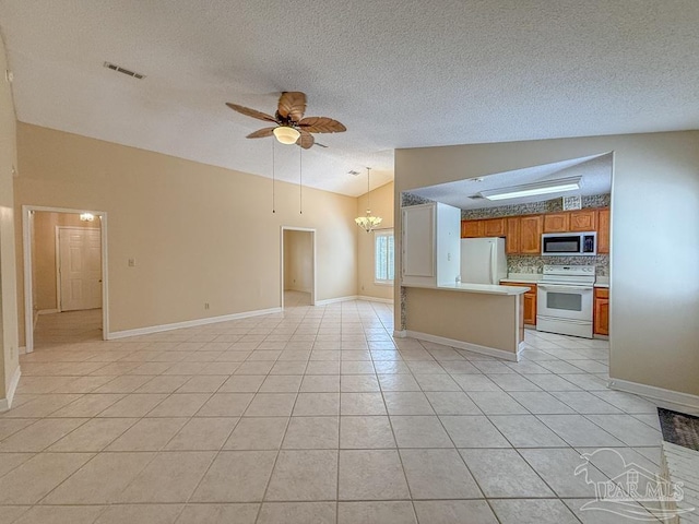 4514 Southpointe Ln, Pensacola, FL 32514 - kitchen featuring white appliances, open floor plan, a ceiling fan, light tile patterned floors, and a textured ceiling