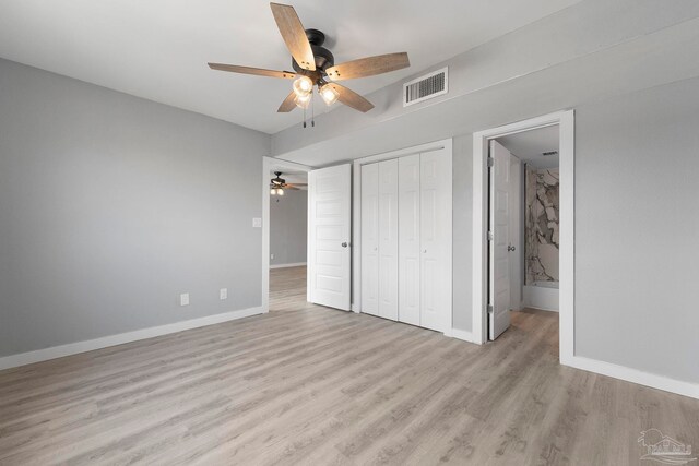 14100 River Rd Unit 223B, Pensacola, FL 32507 - unfurnished bedroom with baseboards, light wood-type flooring, a closet, and a ceiling fan