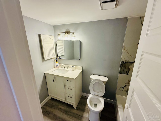 14100 River Rd Unit 223B, Pensacola, FL 32507 - full bath with vanity, wood finished floors, toilet, and baseboards